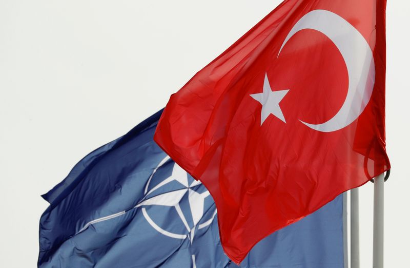 NATO and Turkish flags flutter at the Alliance headquarters in