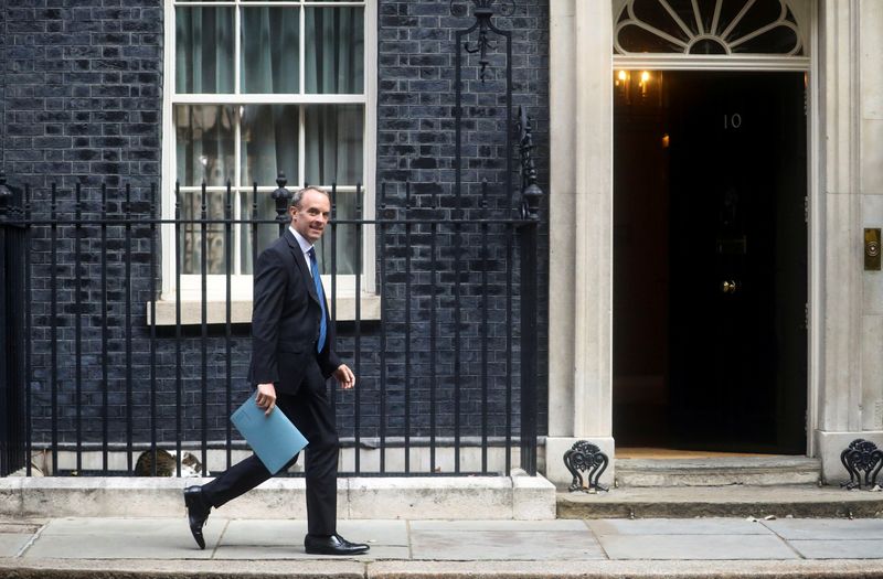 Britain’s Foreign Affairs Secretary Dominic Raab walks outside Downing Street