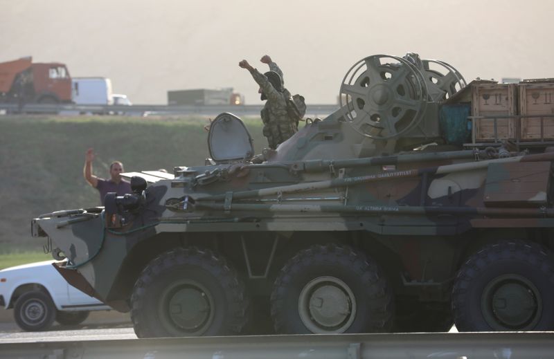 FILE PHOTO: An Azerbaijani service member drives an armoured carrier