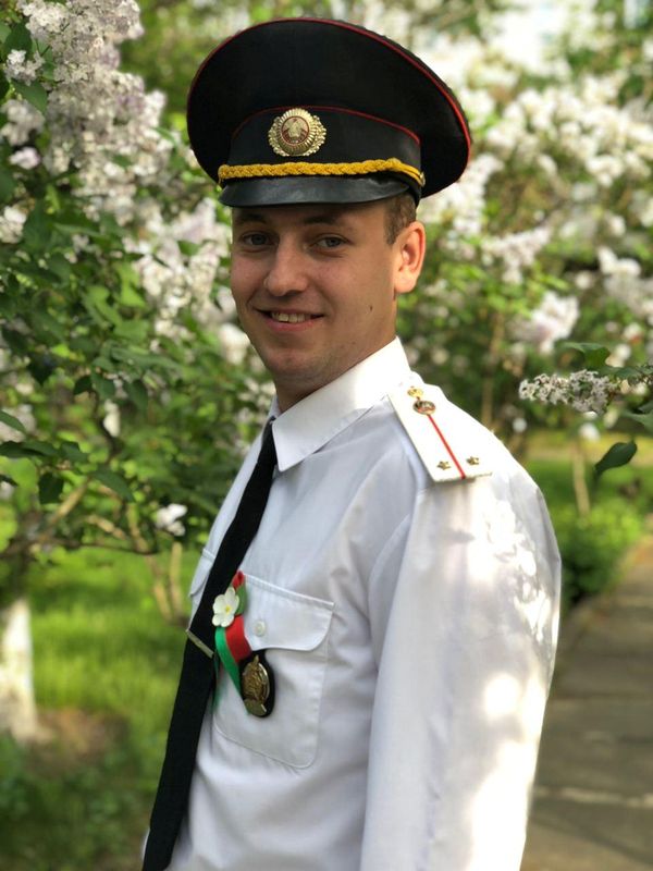 Belarusian police officer Ivan Kolos poses for a picture in
