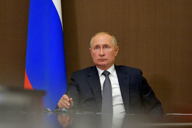 FILE PHOTO: Russian President Vladimir Putin chairs a meeting via