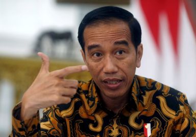 FILE PHOTO: Indonesia’s President Joko Widodo gestures during an interview