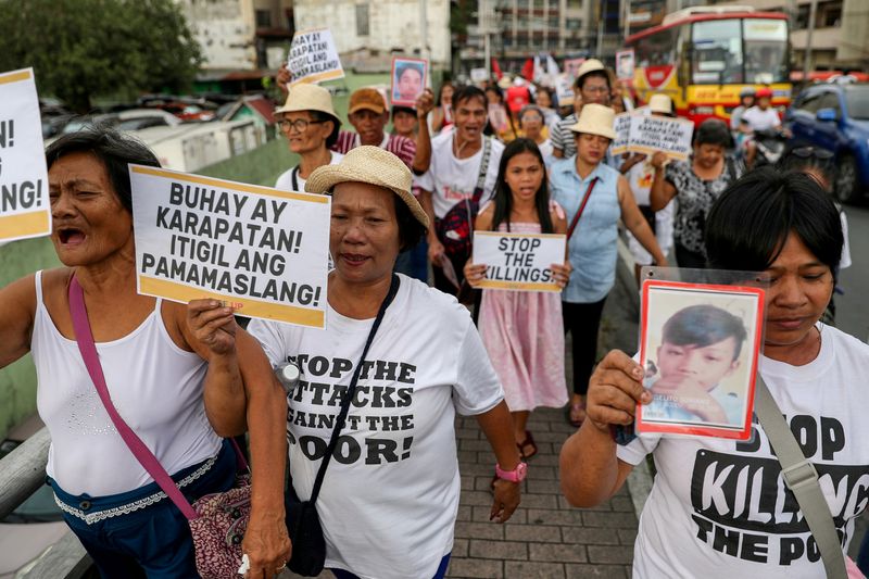 FILE PHOTO: Filipino activists, and relatives of people killed in