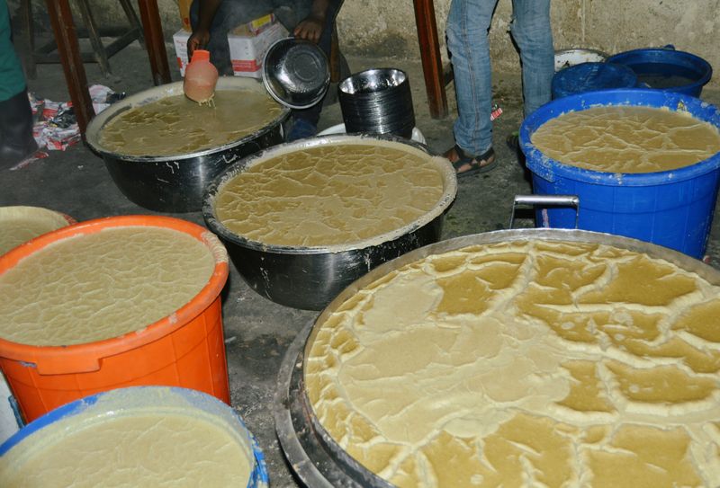 Porridge is seen filled in troughs inside a prison in