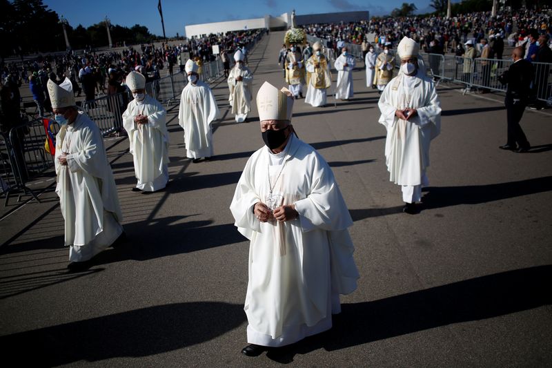 Members of the clergy take part in a procession during