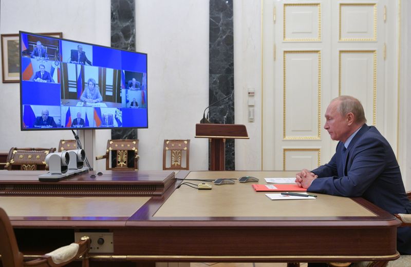 Russia’s President Putin takes part in a video conference call