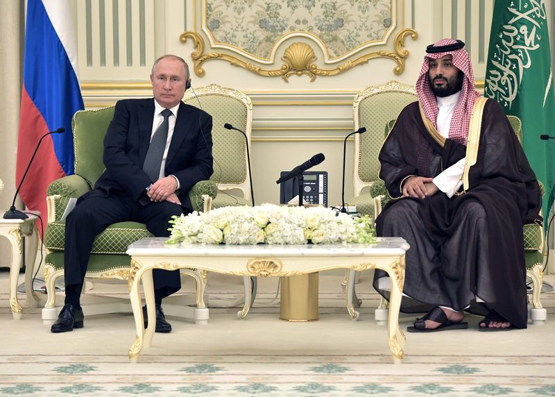 Russian President Vladimir Putin and Saudi Arabia’s Crown Prince Mohammed