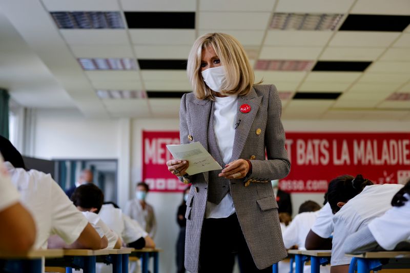 Brigitte Macron gives a dictation to school children in support