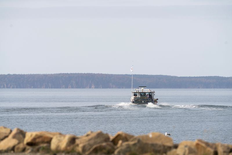 A Mi’kmaq First Nation fishing boat leaves the harbour in