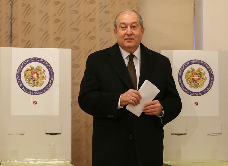 FILE PHOTO: Armenian President Armen Sarkissian votes during an early
