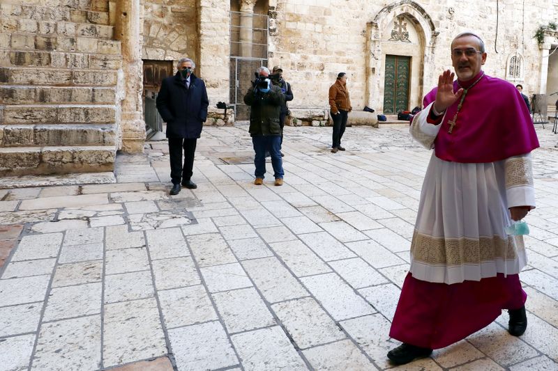 FILE PHOTO: Archbishop Pierbattista Pizzaballa, waves as he enters the