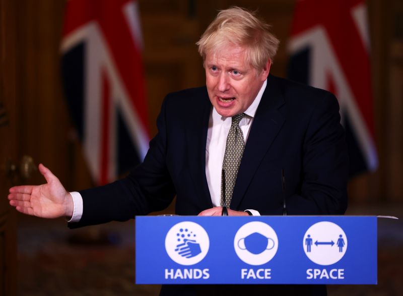 Britain’s PM Johnson attends a news conference in London