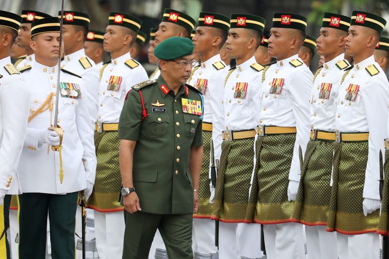 FILE PHOTO: Malaysia’s King Al-Sultan Abdullah inspects guard of honour