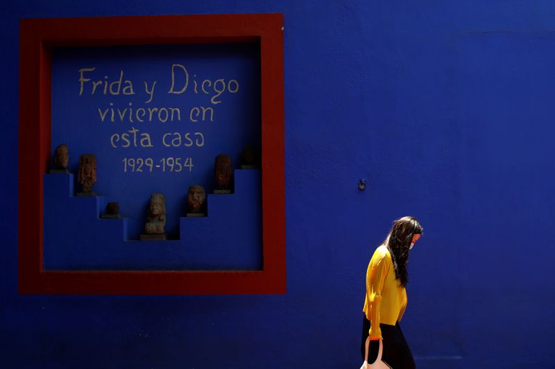 A visitor is seen at Casa Azul (the Blue House),