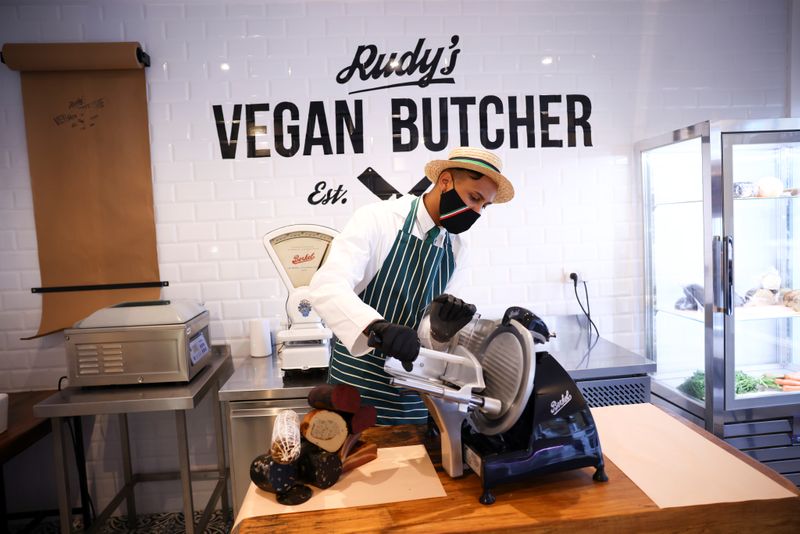 A member of staff works inside ‘Rudy’s Vegan Butcher’ shop,
