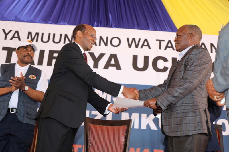 Tanzania’s re-elected President John Pombe Magufuli receives his winning certificate