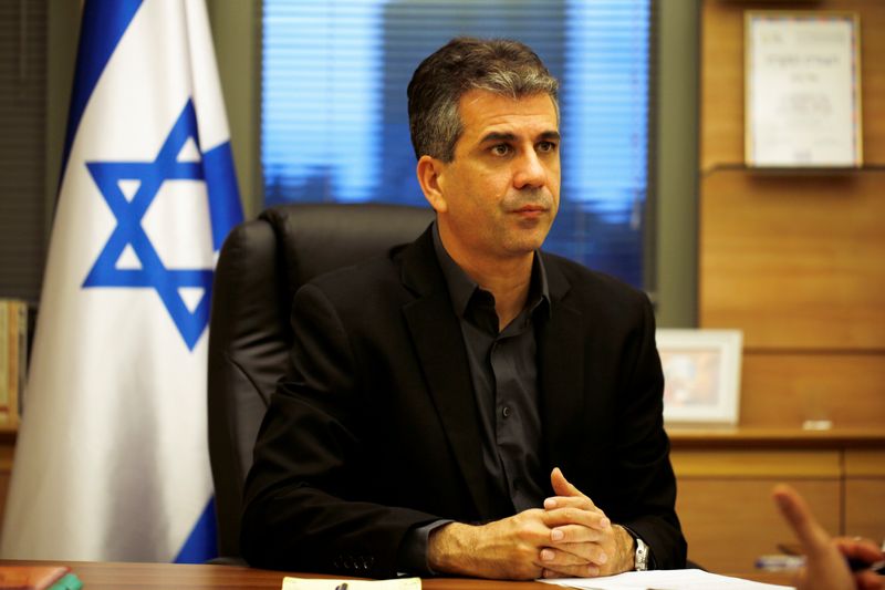 Israel’s Economy Minister Eli Cohen works at his office in
