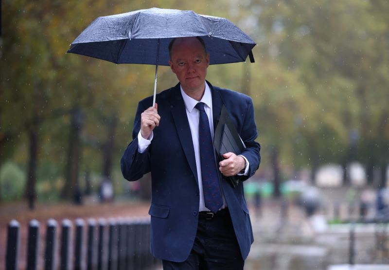 FILE PHOTO: Chief Medical Officer for England Chris Whitty walks