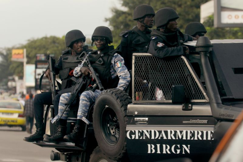 Ivory Coast security forces members surround the residence of former