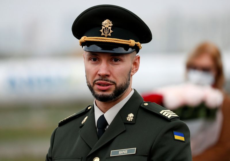 Ukrainian national guard serviceman Markiv arrives at an airport in