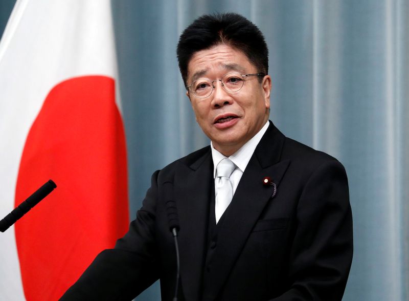 Japan’s Health, Labour and Welfare Minister Kato attends a news