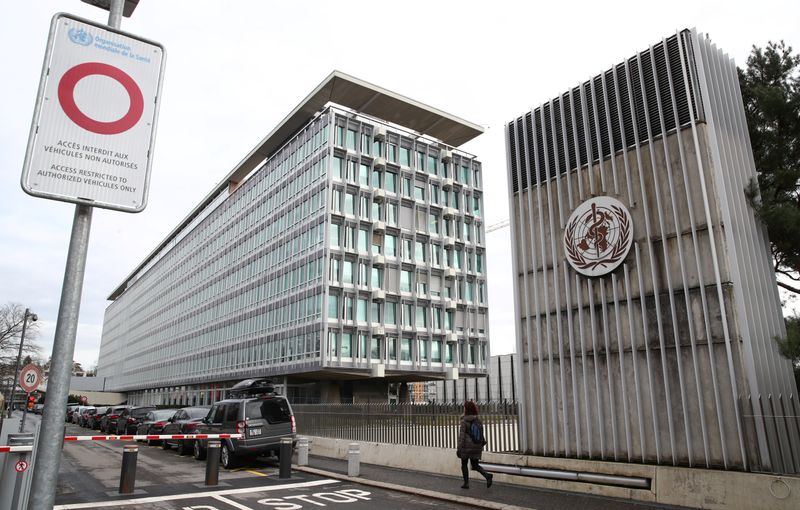 A logo is pictured on the headquarters of the WHO
