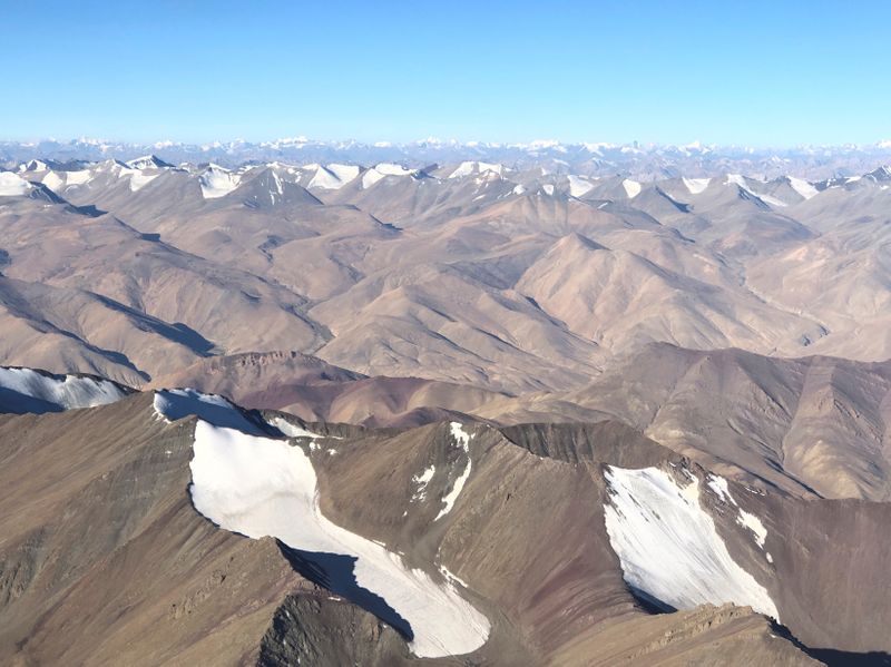 FILE PHOTO: Snow-covered mountain range is seen from a passenger
