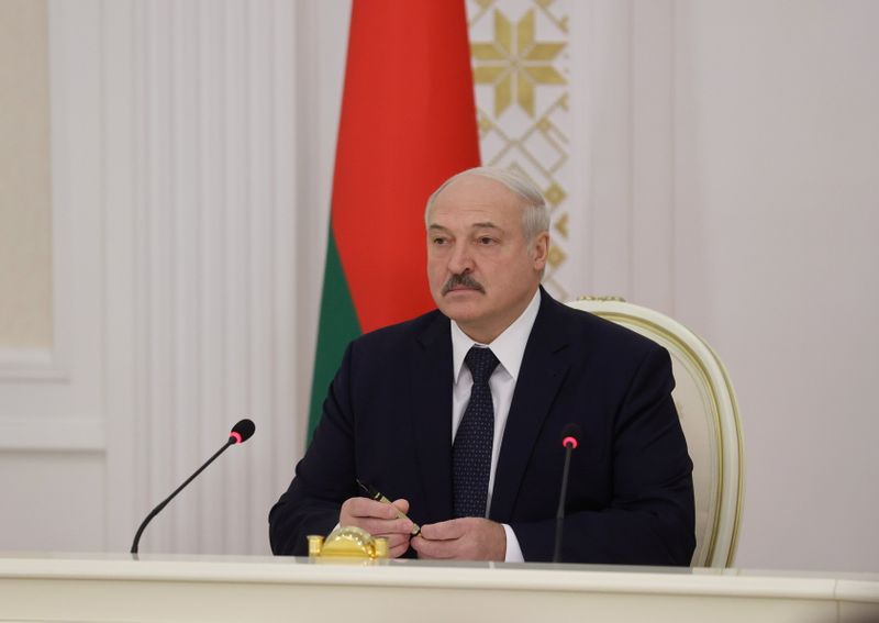 FILE PHOTO: Belarusian President Lukashenko chairs a meeting in Minsk