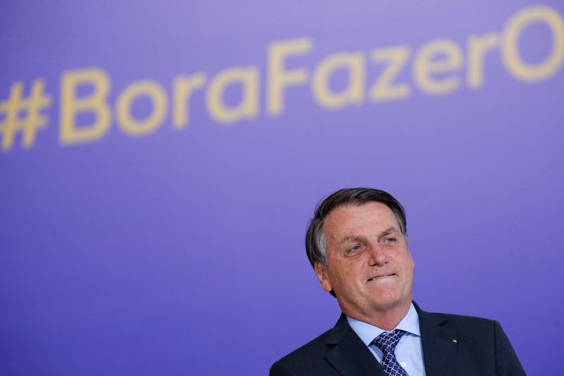 Brazil’s President Jair Bolsonaro looks on during a ceremony at