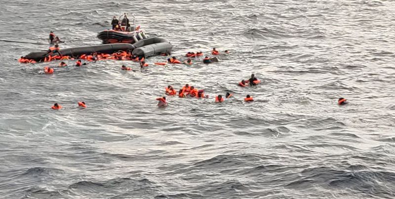 Migrants at sea waiting to be rescued by Spanish search
