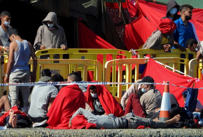 FILE PHOTO: Over two thousand migrants rest in the Arguineguin