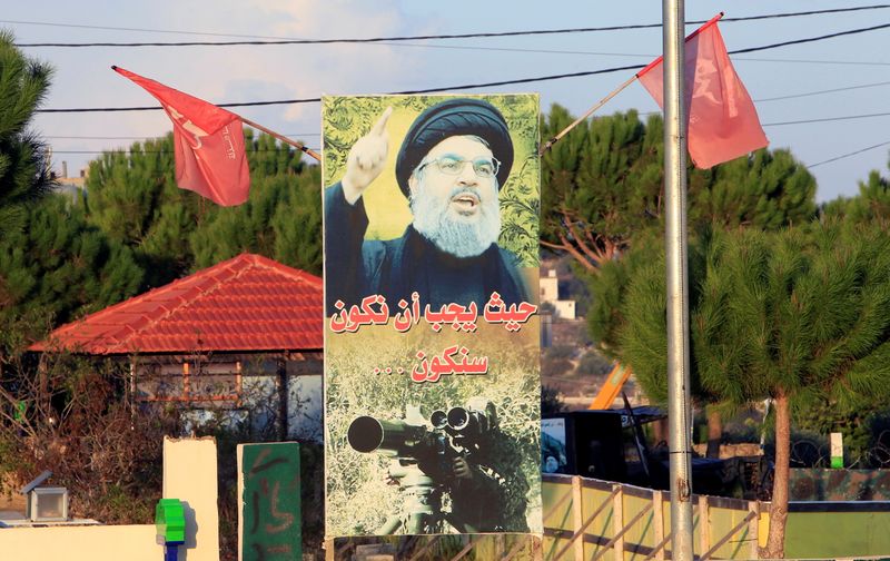 A poster depicting Lebanon’s Hezbollah leader Sayyed Hassan Nasrallah is