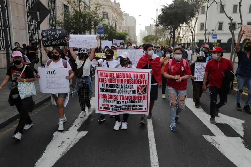 Demonstrators march during protests following the impeachment of President Martin