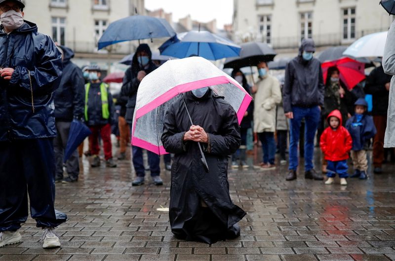 People attend an open air mass in Nantes