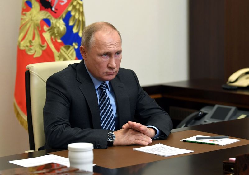 Russian President Vladimir Putin attends a meeting on a humanitarian