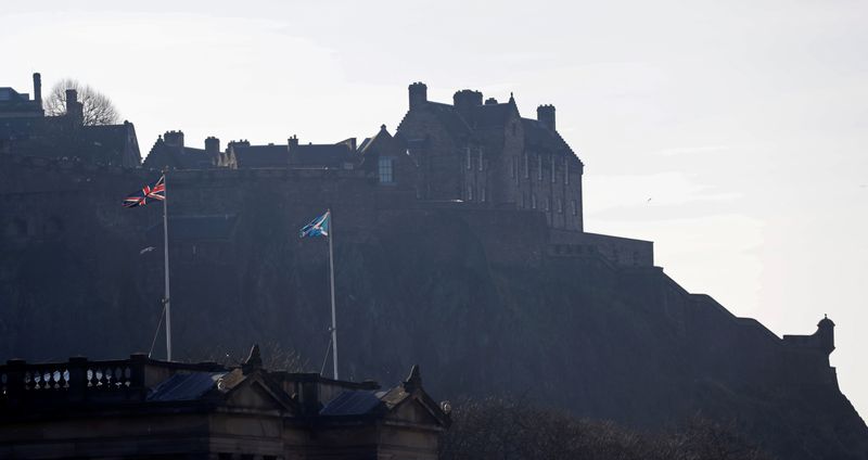 FILE PHOTO: Flags fly in front of Edinburgh Castle, Edinburgh,