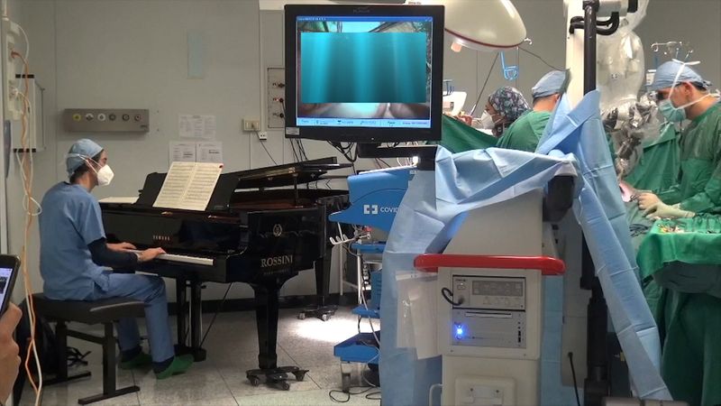 Boys has surgery as piano played next to operating table