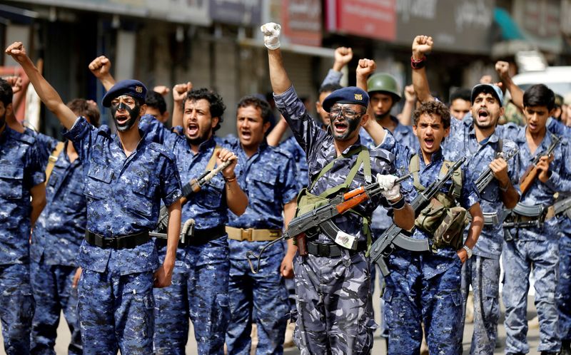 Members of a security force loyal to the Houthi rebels