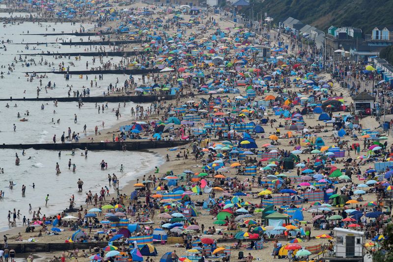 FILE PHOTO: People enjoy the sunny weather at the Bournemouth