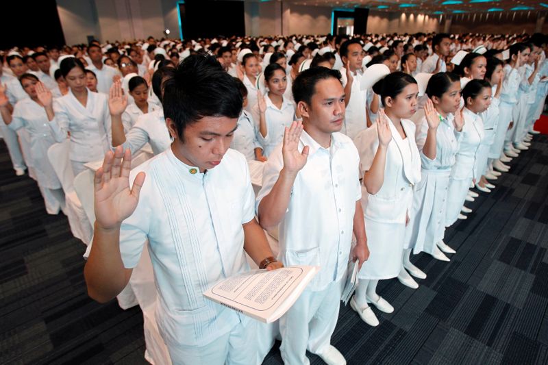 FILE PHOTO: Newly graduate nurses take their oath during an