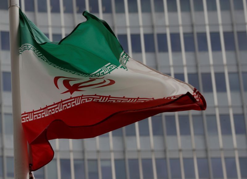 An Iranian flag flutters in front of the IAEA headquarters