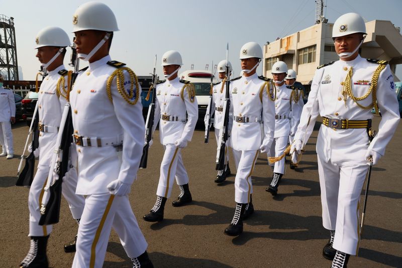 Navy Honor Guards are seen at the ceremony for the