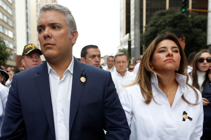Colombia’s President Ivan Duque walks next to with his wife,