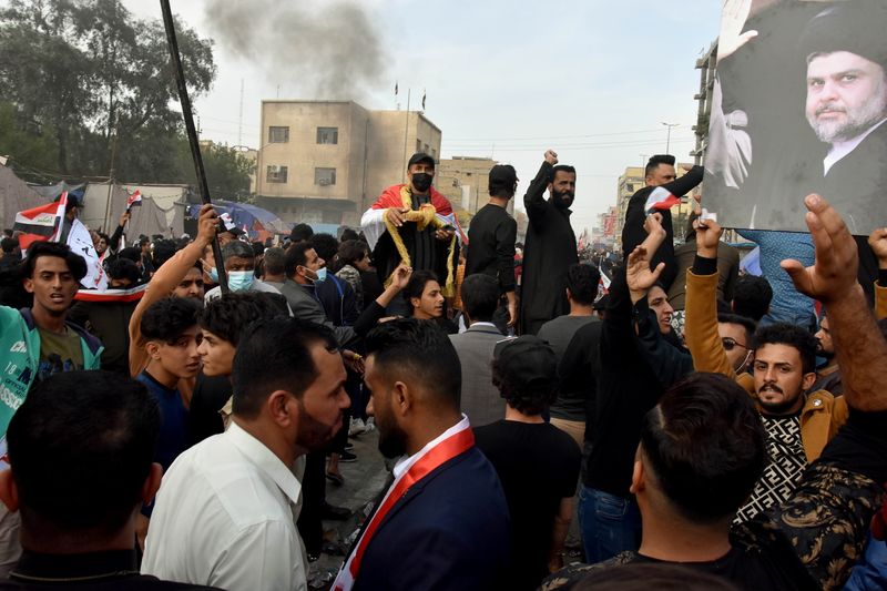Supporters of Iraqi Shi’ite cleric Moqtada al-Sadr are seen during