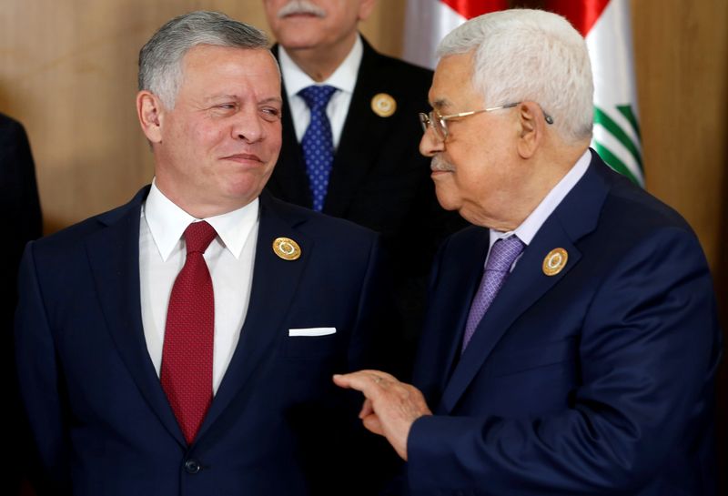 FILE PHOTO: Jordan’s King Abdullah II speaks with Palestinian President