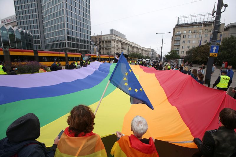 Pro-LGBT demonstrators hold giant rainbow flag in Warsaw
