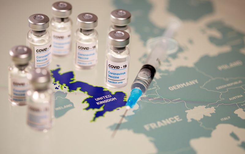 FILE PHOTO: Vials labelled “COVID-19 Coronavirus-Vaccine” and medical syringe are