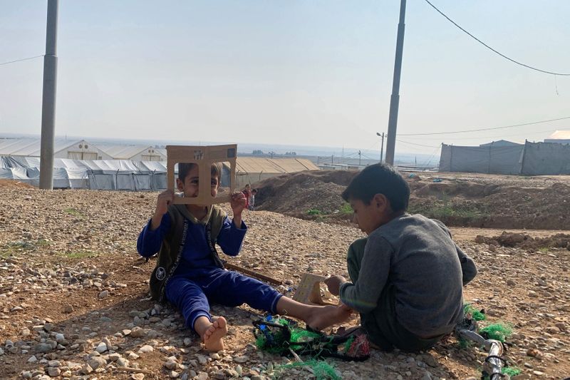 Displaced Iraqi children play at Hassan Sham camp, in al-Khazer