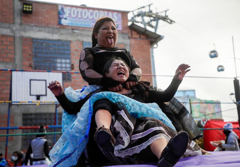 Cholitas wrestlers fight during their return to the ring after