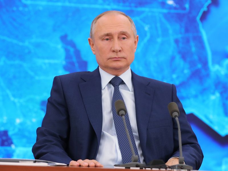 Russian President Vladimir Putin attends his annual end-of-year news conference